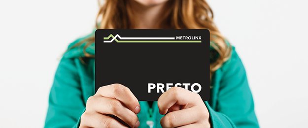 Girl holding a PRESTO card